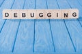 close up view of debugging word made of wooden blocks