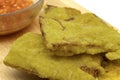 Close-up view of deep fried tempeh or tempe mendoan, Indonesian popular snack, made from thin sliced tempeh covered in flour