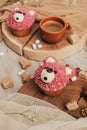 close-up view of delicious sweet cupcakes in shape of bears and cup of coffee Royalty Free Stock Photo