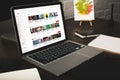 close-up view of designer workplace with notebooks and laptop with youtube website Royalty Free Stock Photo