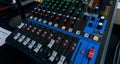 Close up view of Detail with adjusting knobs on a professional sound system mixer audio equipment board on a table at wedding Royalty Free Stock Photo