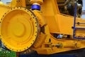 Close-up view of the detail of a large mining truck in the production workshop of the plant. Huge brake disc. Wheel. Truck electri Royalty Free Stock Photo