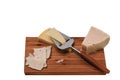 Close up view of different kinds of cheese with cheese knife isolated on wooden board. Healthy food concept Royalty Free Stock Photo