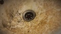 The close up view of the dirty stain inside of the toilet sink in the house. Yellow limescale stain Royalty Free Stock Photo