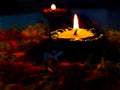 A close-up view of Diya placed on table with flowers for pooja Royalty Free Stock Photo