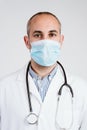 Close up view of doctor man wearing protective mask, gloves and stethoscope. Coronavirus Covid-19 concept Royalty Free Stock Photo