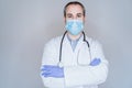 close up view of doctor man wearing protective mask, gloves and stethoscope. Coronavirus Covid-19 concept Royalty Free Stock Photo
