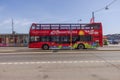 Close-up view of double-decker tourist bus traveling on road in streets of Stockholm. Royalty Free Stock Photo