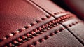 Close-up view of double-needle stitching on red leather surface showcasing precision craftsmanship Royalty Free Stock Photo