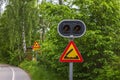 Close-up view of drawbridge warning road sign under stoplight before danger. Royalty Free Stock Photo