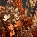 Close-up view of a dried floral arrangement featuring rustic orange and beige botanical elements with warm lighting Royalty Free Stock Photo