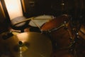 Close-up view of a drum set with drumsticks in a dimly lit recording studio Royalty Free Stock Photo