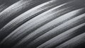 Dynamic diagonal brush strokes creating a textured silver and black abstract background Royalty Free Stock Photo