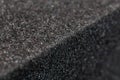 Close-up view of an edge of black rubber foam sponge brick Royalty Free Stock Photo