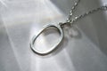 Close up view of elegant sterling silver pendant Royalty Free Stock Photo