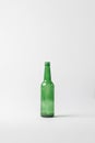 close up view of empty glass bottle isolated on grey, recycling concept Royalty Free Stock Photo