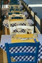 Close up view of empty quaint little restaurant with tables set on the sidewalk