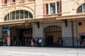 Close-up view of the entrance of Flinders street station with the name written and people in Melbourne Victoria Australia Royalty Free Stock Photo