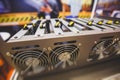 Close-up view of equipment for bitcoin cryptocurrency mining farm, electronic devices with fans, concept of mining technology Royalty Free Stock Photo