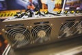 Close-up view of equipment for bitcoin cryptocurrency mining farm, electronic devices with fans, concept of mining technology Royalty Free Stock Photo