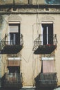 Close-up view of facade with balconies and four windows