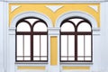 Facade of white yellow ancient building with two isolated arched windows mock up Royalty Free Stock Photo