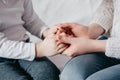 Close up view of family holding hands, loving caring mother supporting child, giving psychological support Royalty Free Stock Photo