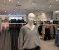 Close up view of a fashion mannequin inside women`s clothing store.