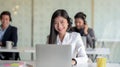 Close up view of  customer service sitting in line call centre operation and talking on headset in office room Royalty Free Stock Photo