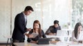 Close up view of female customer service  talking on headset in call centre operation room Royalty Free Stock Photo