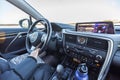 Close up view of female driving Lexus car. Car interiors concept.