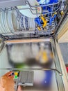 Close up view of female hand inserting dishwasher tablet Royalty Free Stock Photo