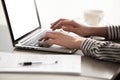 Close up view of female hands typing on laptop keyboard Royalty Free Stock Photo