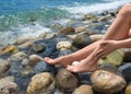 Close up view of a female legs on the beach. Royalty Free Stock Photo