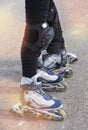 Close-up view of female legs and male legs in roller blades Royalty Free Stock Photo