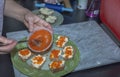 Close up view of female making toasts with red caviar.