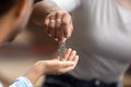 Closeup view of realtor giving keys to new house owner Royalty Free Stock Photo