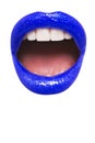 Close-up view of female wearing dark blue lipstick with mouth open over white background Royalty Free Stock Photo