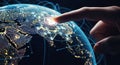 Finger touching illuminated digital globe network connection point over dark earth night, for global communication, Royalty Free Stock Photo