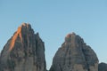 A close up view on the first sunbeams reaching the top of the Tre Cime di Lavaredo (Drei Zinnen), Italian Dolomites. Royalty Free Stock Photo