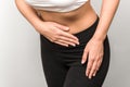 Close up view of a fitness woman having abdominal pain