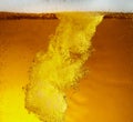 Close up view of floating bubbles in light beer texture Royalty Free Stock Photo