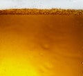 Close up view of floating bubbles in light beer texture Royalty Free Stock Photo