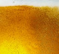 Close up view of floating bubbles in light beer texture Royalty Free Stock Photo