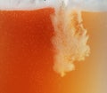 Close up view of floating bubbles in unfiltered beer texture