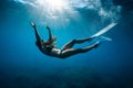 Close up view of freediver woman with fins in underwater. Freediving with girl