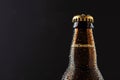 Close-up view of fresh bottles of beer with a light shining on the top of the bottle and bottom half of the bottle. Ai Royalty Free Stock Photo