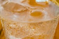 Close Up View of a Fresh Cold Soda Beverage in a Glass with Ice Cubes. Liquid Abstract Background. Macro Photography. Royalty Free Stock Photo