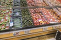 Close up view of fresh fruits and vegetables on supermarket shelf.