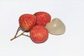Close up view of fresh red lychees on white background